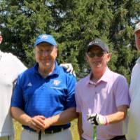 another 4 men pose with eachother